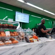 A cafe worker using the cash register at the Saint Louis Art Museum Cafe Cafe at the Saint Louis Art Museum